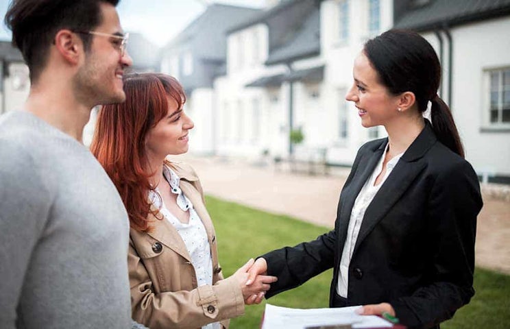 woman shaking hands with sales women shaking hands