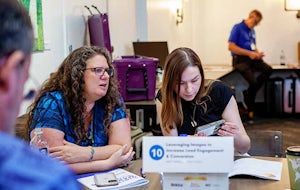 HDMS22-108-Roundtable-Leah-Fellows-Jenn-Edits-2 Leah Fellows having a discussion at a conference table