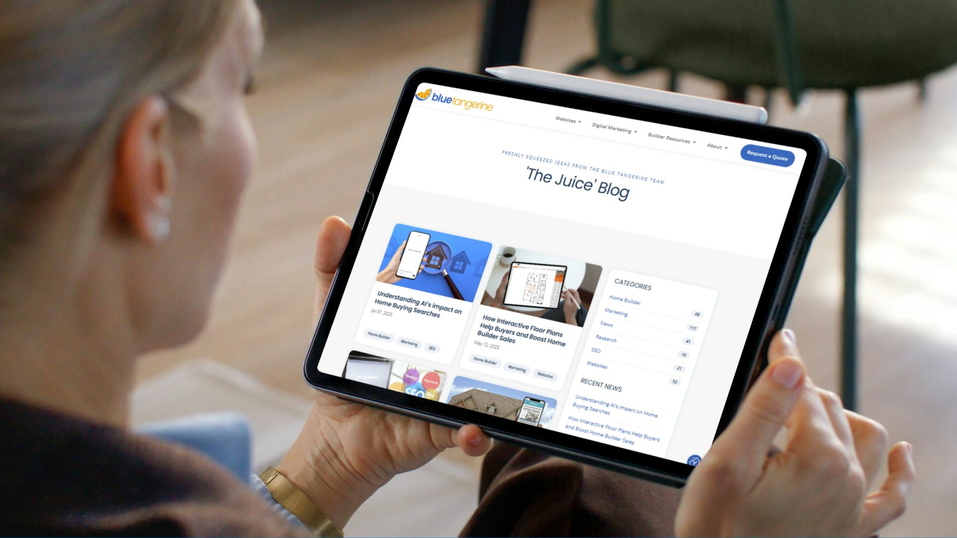 Person reading the Blue Tangerine Juice Blog on a tablet